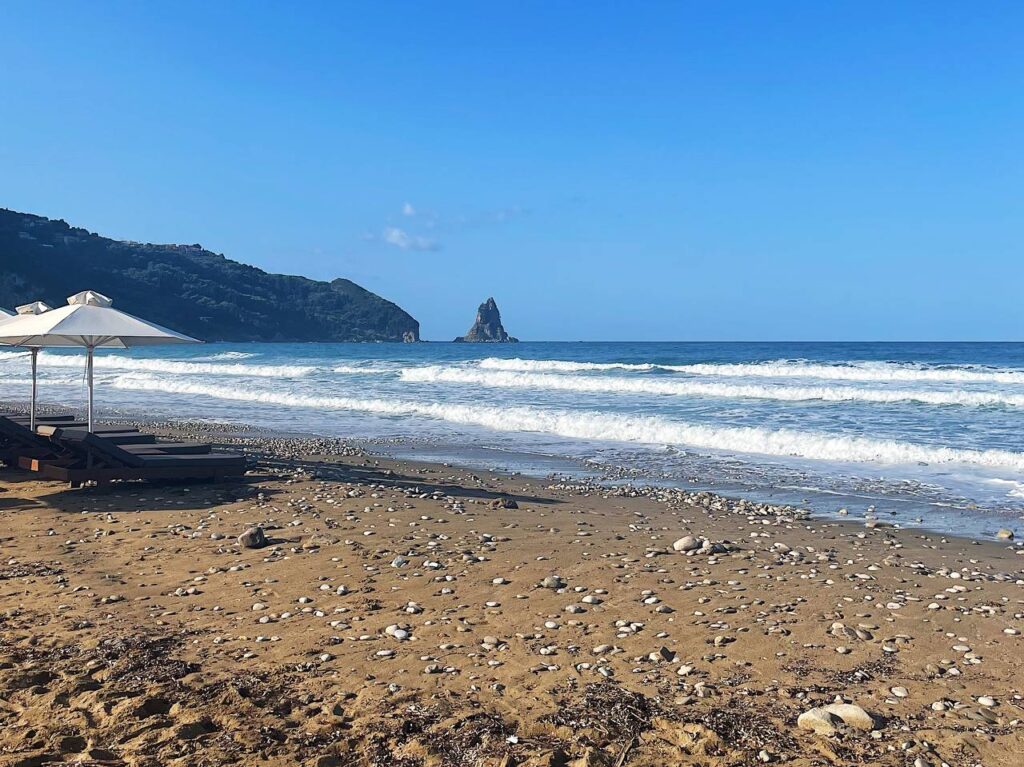 Agios Gordios beach view with sunbed